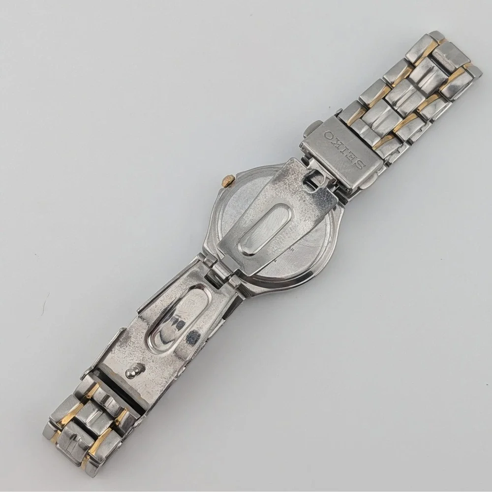 Seiko 7N82-0AG0 Blue Sunburst Two Tone Date Quartz Watch 50M‎
